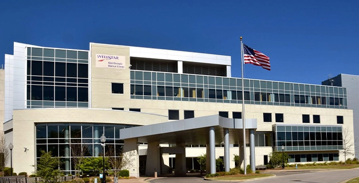 white building with American flag in front of it