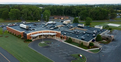 An exterior daytime view of the AdventHealth Murray hospital building, showing the facility's entrance with 