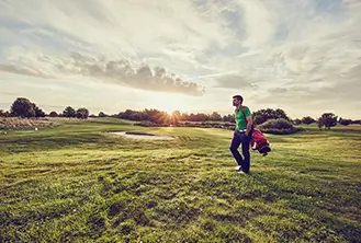 man walking alone in the grass