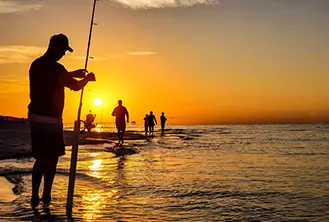 man fishing in a sunset