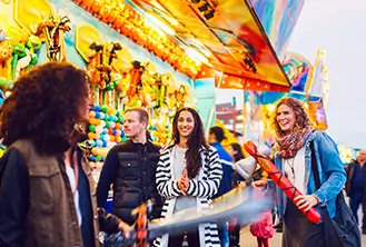 group of young people smiling at a fair