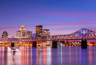 photograph of a city under a purple sunset
