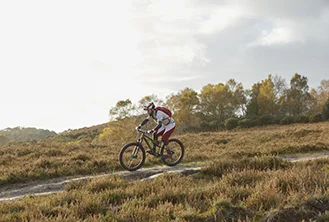 man riding a mountain on his bicycle