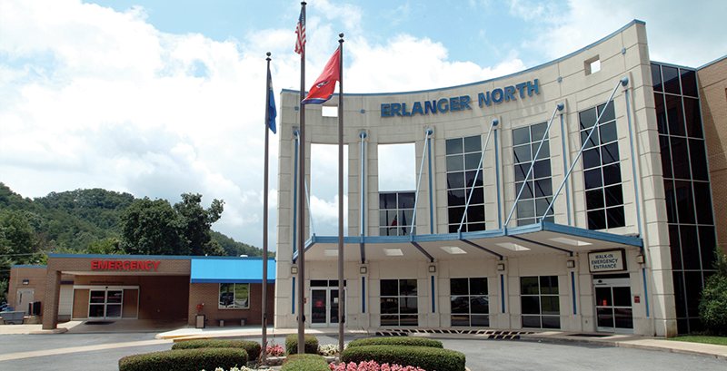 External view of a brick building with a curved entrance