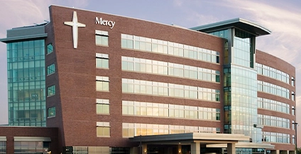 brick building with a white cross on the side