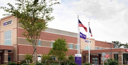 brick building next to the united states flag