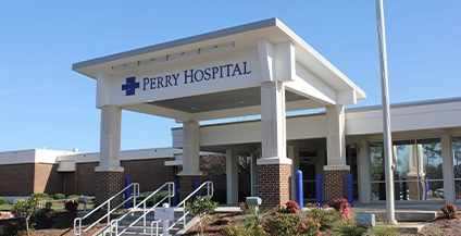 building with a sign that says perry hospital