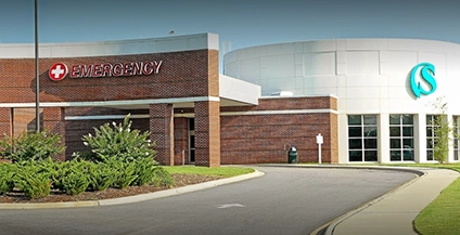 emergency entrance of a hospital with a brick facade