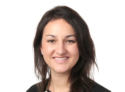 Headshot of Jackie Olliff, smiling, wearing a black blazer